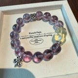 This is a crystal bracelet that consists of amethyst, citrine and chrome hearts spacers.