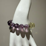 This is a crystal bracelet that consists of amethyst, citrine and chrome hearts spacers.