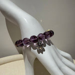 This is a crystal bracelet that consists of amethyst, citrine and chrome hearts spacers.
