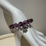 This is a crystal bracelet that consists of amethyst, citrine and chrome hearts spacers.