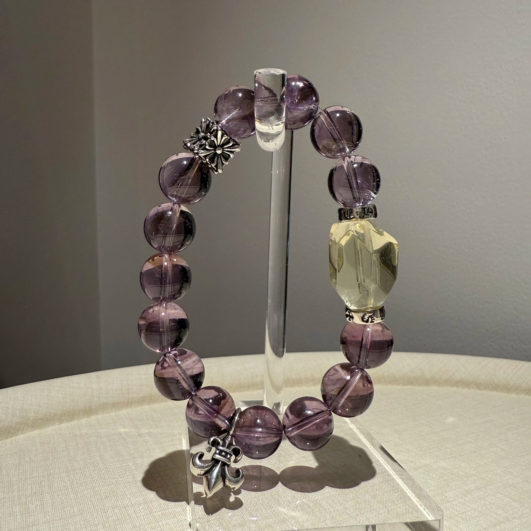This is a crystal bracelet that consists of amethyst, citrine and chrome hearts spacers.
