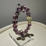 This is a crystal bracelet that consists of amethyst, citrine and chrome hearts spacers.