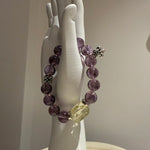 This is a crystal bracelet that consists of amethyst, citrine and chrome hearts spacers.