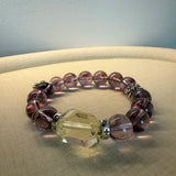 This is a crystal bracelet that consists of amethyst, citrine and chrome hearts spacers.