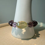 This is a crystal bracelet that consists of amethyst, citrine and chrome hearts spacers.