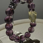 This is a crystal bracelet that consists of amethyst, citrine and chrome hearts spacers.