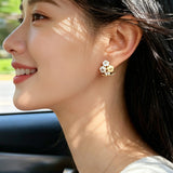 These 18k gold-plated stud/clip earrings feature delicate blossoms crafted with enamel glaze and inlaid with sparkling zircon stones. The combination of soft blue, creamy yellow and lustrous gold creates a romantic and feminine look that captures the essence of blooming florals.