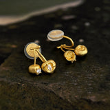These cherry-shaped stud earrings feature a luxurious matte sandblasted finish, crafted from thick-plated real gold over 925 sterling silver posts. Each earring is designed as a pair of cherries, adorned with a marquise-cut and a round-cut sparkling clear stone, adding a delicate, eye-catching sparkle. The playful, organic cherry silhouette and premium gold plating make them a chic, elegant accessory for everyday wear.