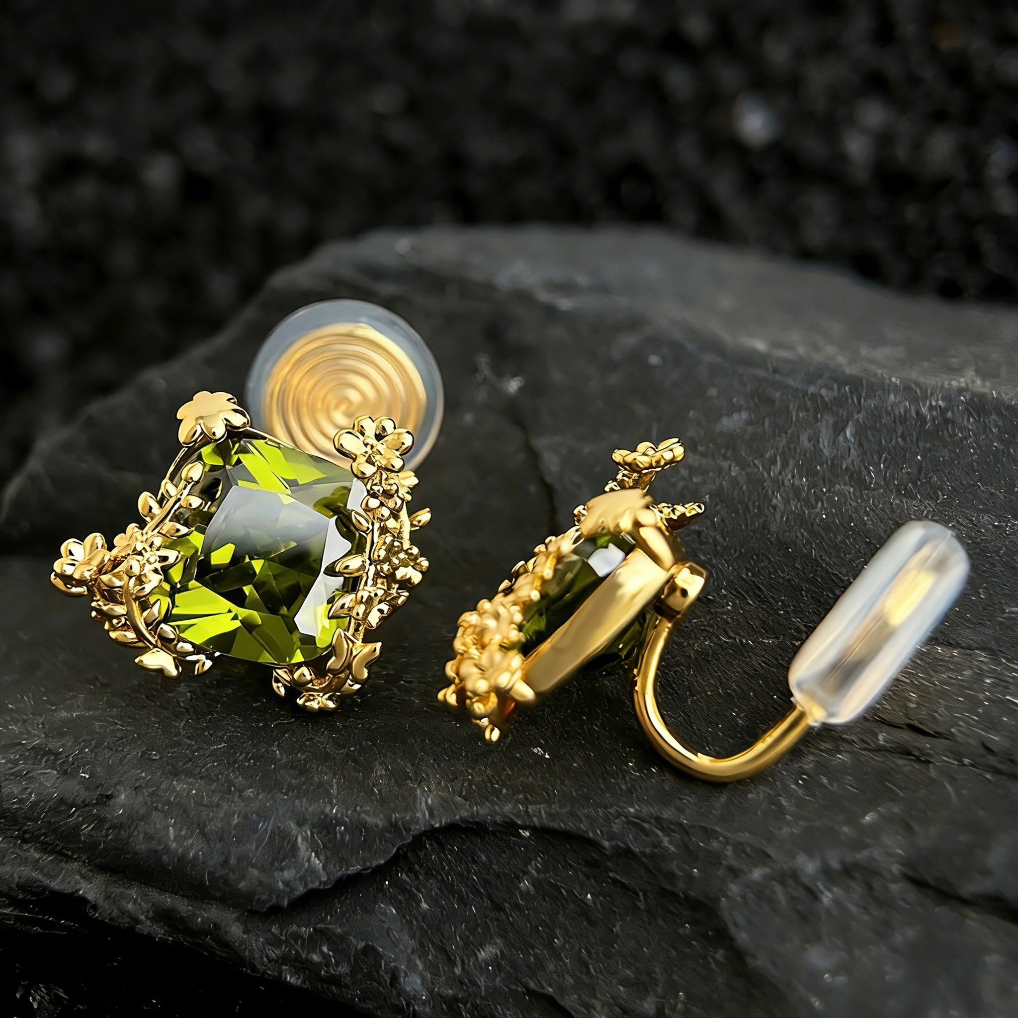 These stud earrings feature cushion-cut olive-green cubic zirconia stones, each encircled by delicate, nature-inspired gold floral and vine detailing. The thick 18K gold plating lends a rich, warm luster, contrasting beautifully with the deep green cubic zirconia to create an elegant, botanical aesthetic.