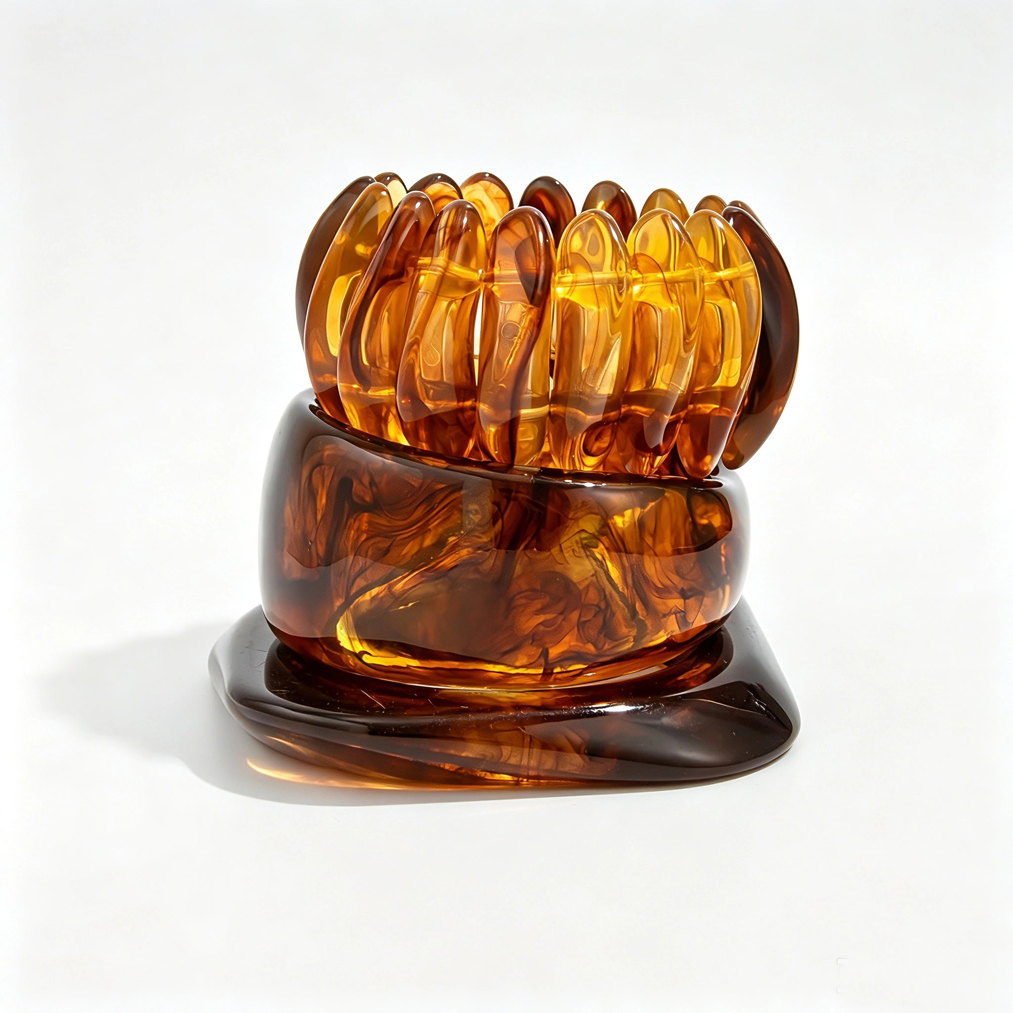 Crafted from translucent acrylic, these amber marbled bangles feature organic swirling tones for a vintage aesthetic. The 3-piece set includes varied shapes that stack beautifully, adding earthy retro charm to any outfit. Smooth, polished surfaces deliver a lightweight, comfortable wearing experience.