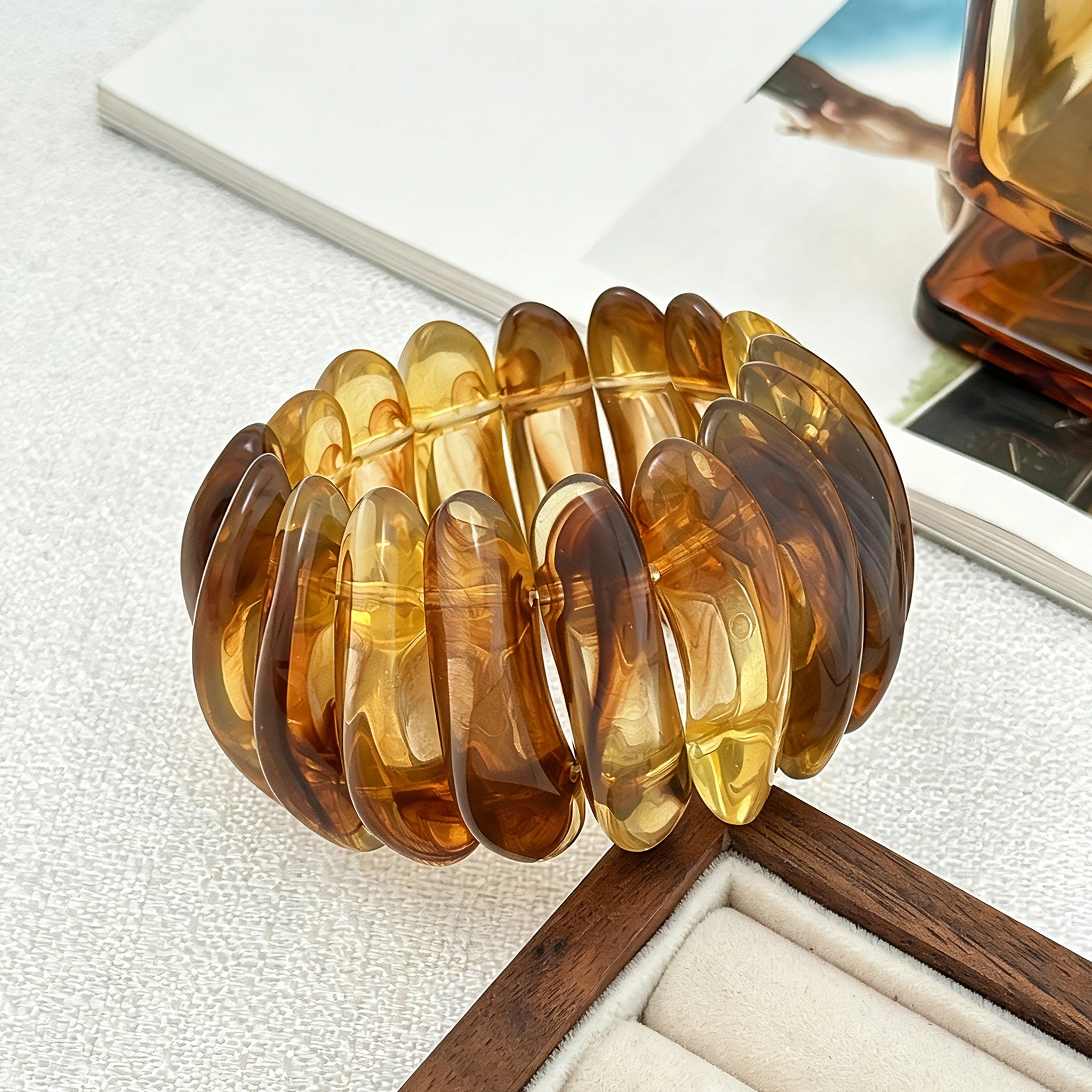 Crafted from translucent acrylic, these amber marbled bangles feature organic swirling tones for a vintage aesthetic. The 3-piece set includes varied shapes that stack beautifully, adding earthy retro charm to any outfit. Smooth, polished surfaces deliver a lightweight, comfortable wearing experience.