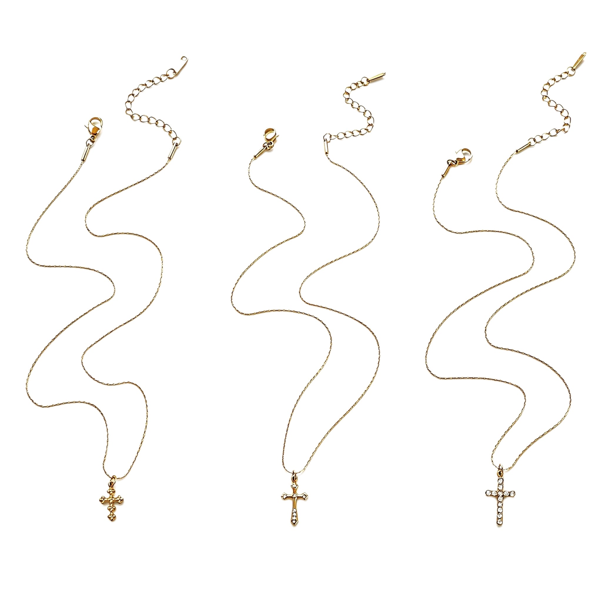This 3-piece stainless steel cross necklace set features three distinct cross pendants, including crystal-encrusted styles and an ornate floral cross. Crafted in polished gold tone, the delicate thin chains are perfect for trendy layered stacking looks. Waterproof and durable, these dainty cross necklaces deliver timeless vintage charm for everyday wear.