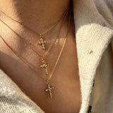 This 3-piece stainless steel cross necklace set features three distinct cross pendants, including crystal-encrusted styles and an ornate floral cross. Crafted in polished gold tone, the delicate thin chains are perfect for trendy layered stacking looks. Waterproof and durable, these dainty cross necklaces deliver timeless vintage charm for everyday wear.