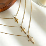 This 3-piece stainless steel cross necklace set features three distinct cross pendants, including crystal-encrusted styles and an ornate floral cross. Crafted in polished gold tone, the delicate thin chains are perfect for trendy layered stacking looks. Waterproof and durable, these dainty cross necklaces deliver timeless vintage charm for everyday wear.