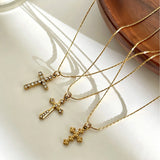 This 3-piece stainless steel cross necklace set features three distinct cross pendants, including crystal-encrusted styles and an ornate floral cross. Crafted in polished gold tone, the delicate thin chains are perfect for trendy layered stacking looks. Waterproof and durable, these dainty cross necklaces deliver timeless vintage charm for everyday wear.