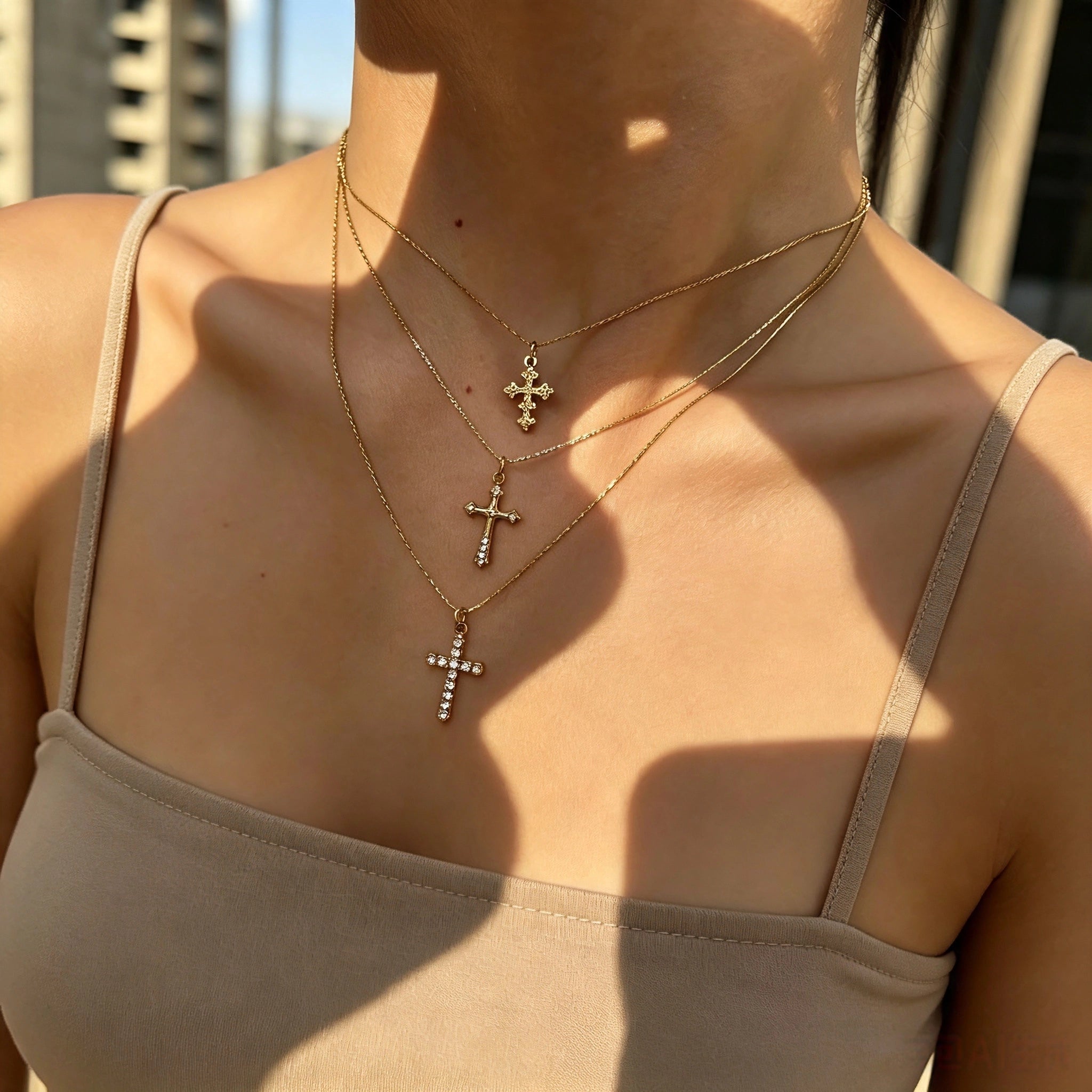 This 3-piece stainless steel cross necklace set features three distinct cross pendants, including crystal-encrusted styles and an ornate floral cross. Crafted in polished gold tone, the delicate thin chains are perfect for trendy layered stacking looks. Waterproof and durable, these dainty cross necklaces deliver timeless vintage charm for everyday wear.