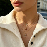This 3-piece stainless steel cross necklace set features three distinct cross pendants, including crystal-encrusted styles and an ornate floral cross. Crafted in polished gold tone, the delicate thin chains are perfect for trendy layered stacking looks. Waterproof and durable, these dainty cross necklaces deliver timeless vintage charm for everyday wear.