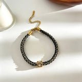 This vintage-inspired 3-piece bracelet set features a wavy gold bangle, engraved stainless steel bead chain and mixed black braided cord bracelet. Crafted from durable stainless steel, this stackable jewelry delivers timeless east-meets-west aesthetics for effortless layered styling. It is a versatile everyday accessory to elevate casual and chic outfits.