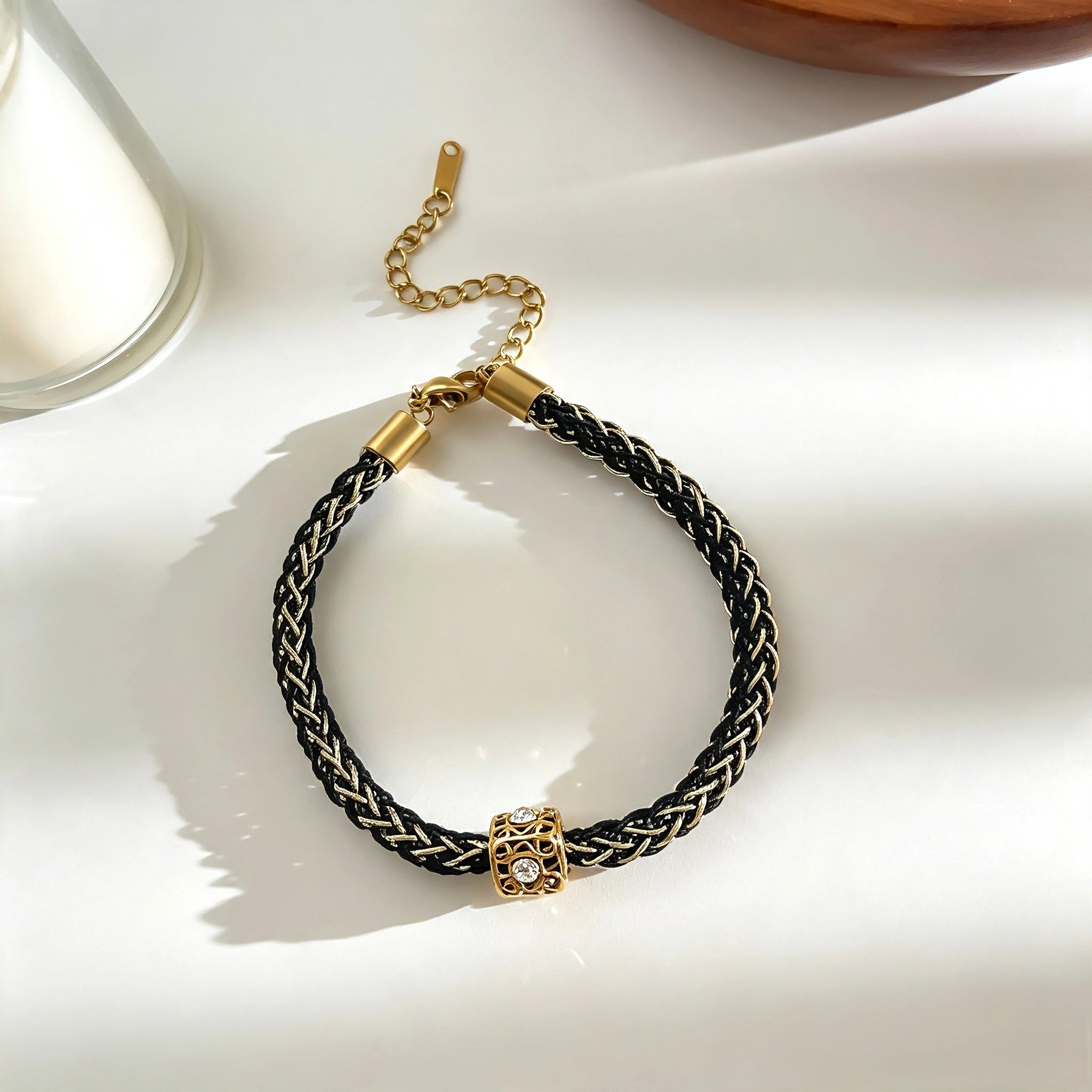 This vintage-inspired 3-piece bracelet set features a wavy gold bangle, engraved stainless steel bead chain and mixed black braided cord bracelet. Crafted from durable stainless steel, this stackable jewelry delivers timeless east-meets-west aesthetics for effortless layered styling. It is a versatile everyday accessory to elevate casual and chic outfits.