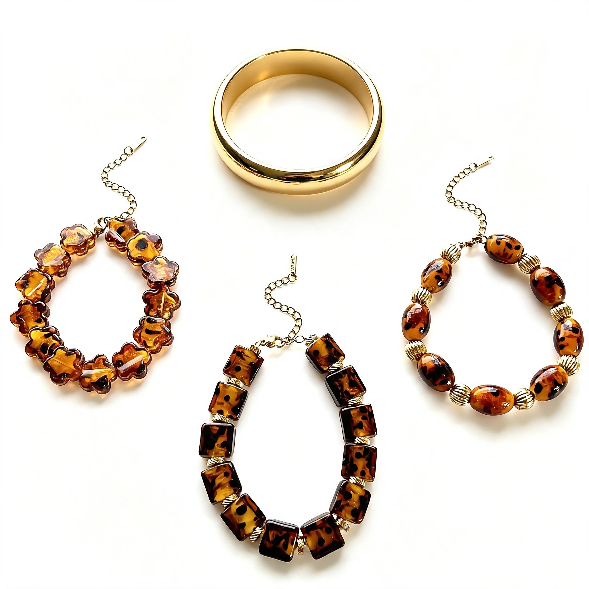 This 4-piece stackable bracelet set blends glossy tortoiseshell-pattern glass beads with polished stainless steel hardware. It includes flower-shaped, square, and oval beaded bracelets paired with a flexible gold-tone ribbed bangle. Perfect for layered styling, these warm earthy-toned accessories effortlessly elevate everyday and evening outfits.
