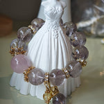 This is a bracelet featuring high-clarity amethyst, rose quartz, and citrine. It's an elegant look of pure peace.