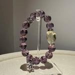 A gradient of amethyst purple, citrine gold and sterling white turns this simple crystal bracelet into a statement of cosmic harmony.