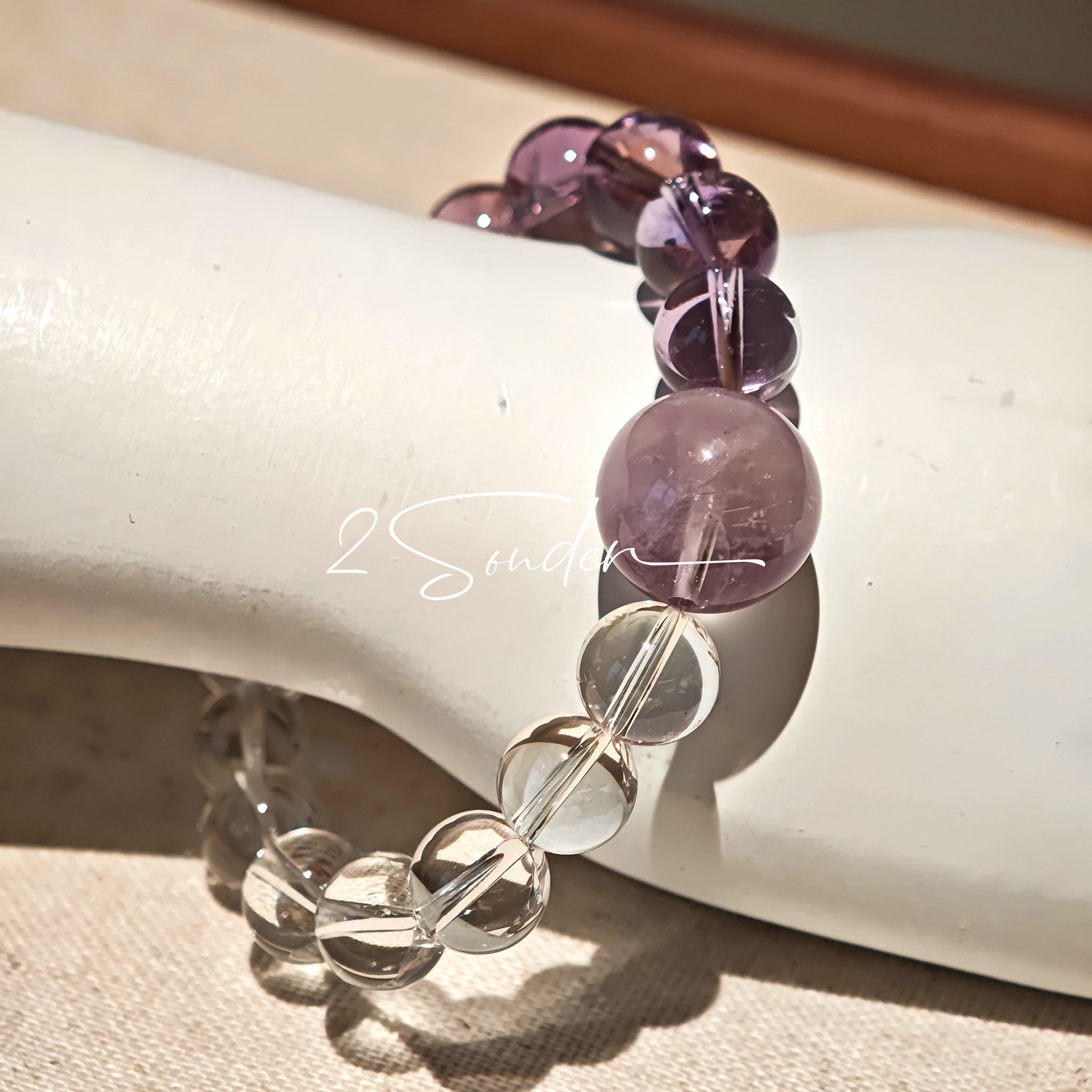 This handcrafted bracelet blends the serene clarity of clear quartz with the dreamy, calming energy of amethyst. The gradient of purple and clear beads creates a timeless, elegant look, perfect for bringing balance, intuition, and positive energy to your everyday style. A stunning piece for crystal lovers and minimalist jewelry enthusiasts alike.