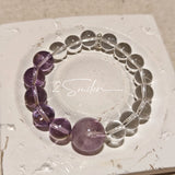 This handcrafted bracelet blends the serene clarity of clear quartz with the dreamy, calming energy of amethyst. The gradient of purple and clear beads creates a timeless, elegant look, perfect for bringing balance, intuition, and positive energy to your everyday style. A stunning piece for crystal lovers and minimalist jewelry enthusiasts alike.