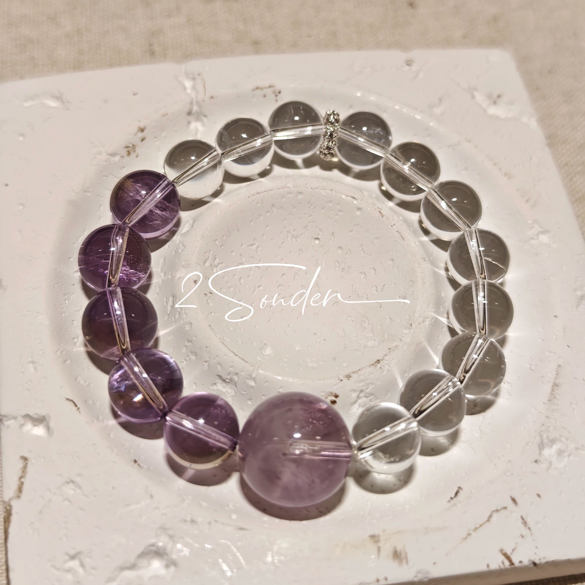 This handcrafted bracelet blends the serene clarity of clear quartz with the dreamy, calming energy of amethyst. The gradient of purple and clear beads creates a timeless, elegant look, perfect for bringing balance, intuition, and positive energy to your everyday style. A stunning piece for crystal lovers and minimalist jewelry enthusiasts alike.