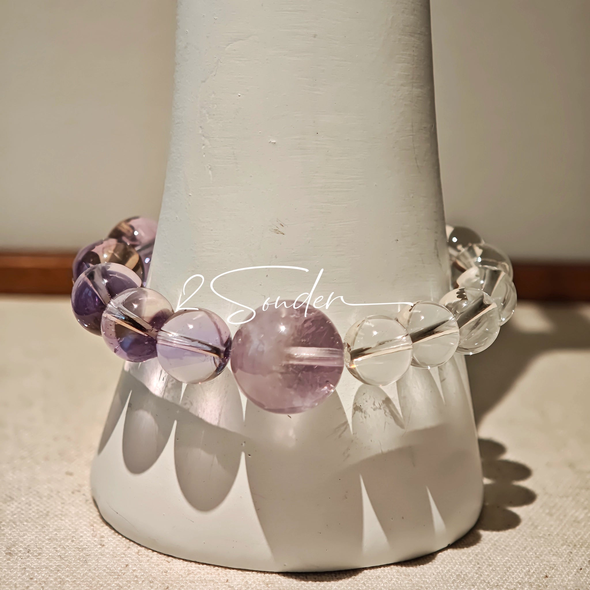 This handcrafted bracelet blends the serene clarity of clear quartz with the dreamy, calming energy of amethyst. The gradient of purple and clear beads creates a timeless, elegant look, perfect for bringing balance, intuition, and positive energy to your everyday style. A stunning piece for crystal lovers and minimalist jewelry enthusiasts alike.
