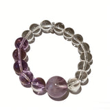 This handcrafted bracelet blends the serene clarity of clear quartz with the dreamy, calming energy of amethyst. The gradient of purple and clear beads creates a timeless, elegant look, perfect for bringing balance, intuition, and positive energy to your everyday style. A stunning piece for crystal lovers and minimalist jewelry enthusiasts alike.