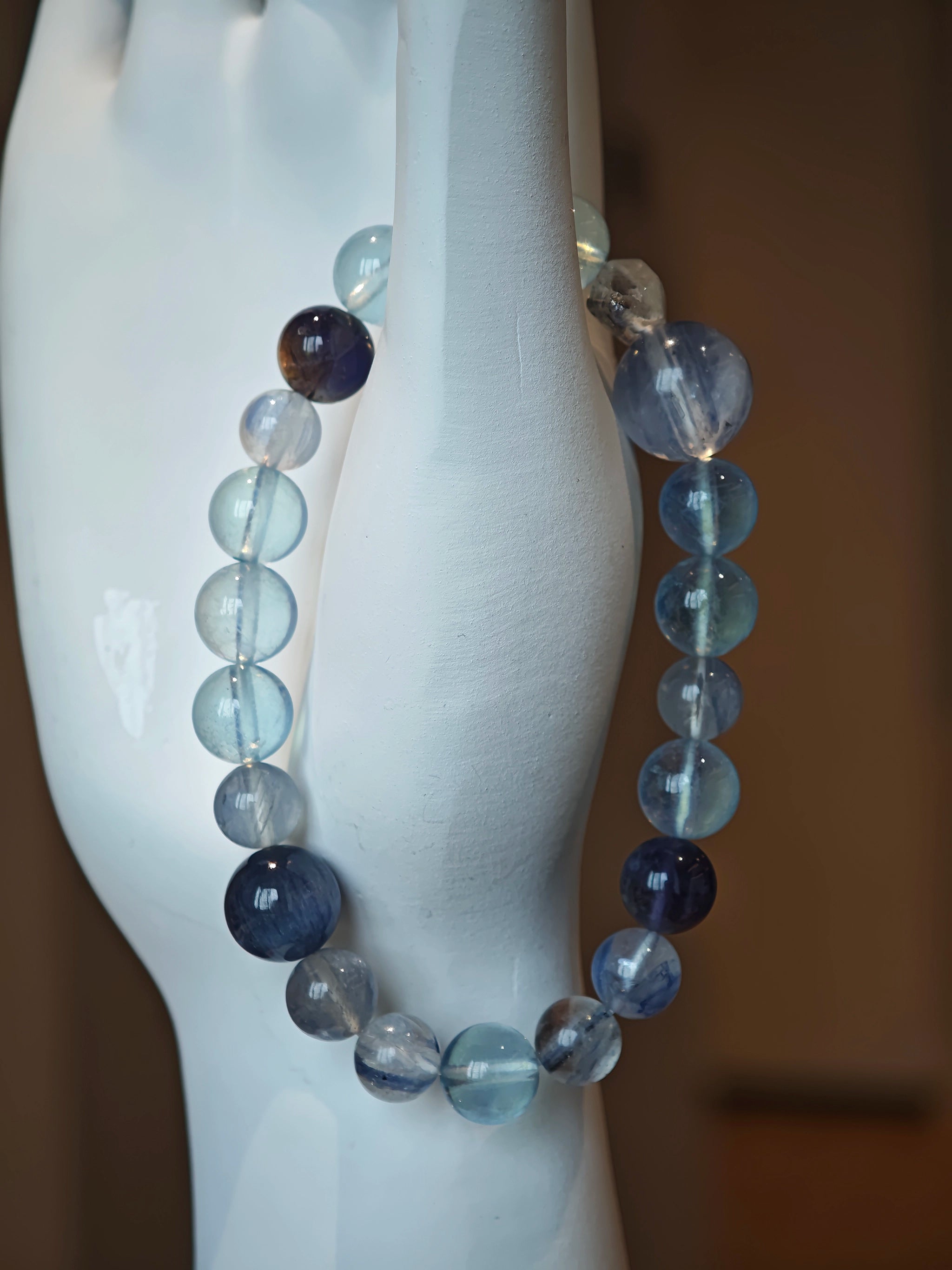 This is a gemstone bracelet consists of Kyanite, Blue Velvet Stone, Aquamarine, and Cordierite.