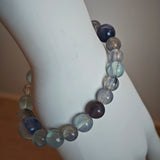 This is a gemstone bracelet consists of Kyanite, Blue Velvet Stone, Aquamarine, and Cordierite.