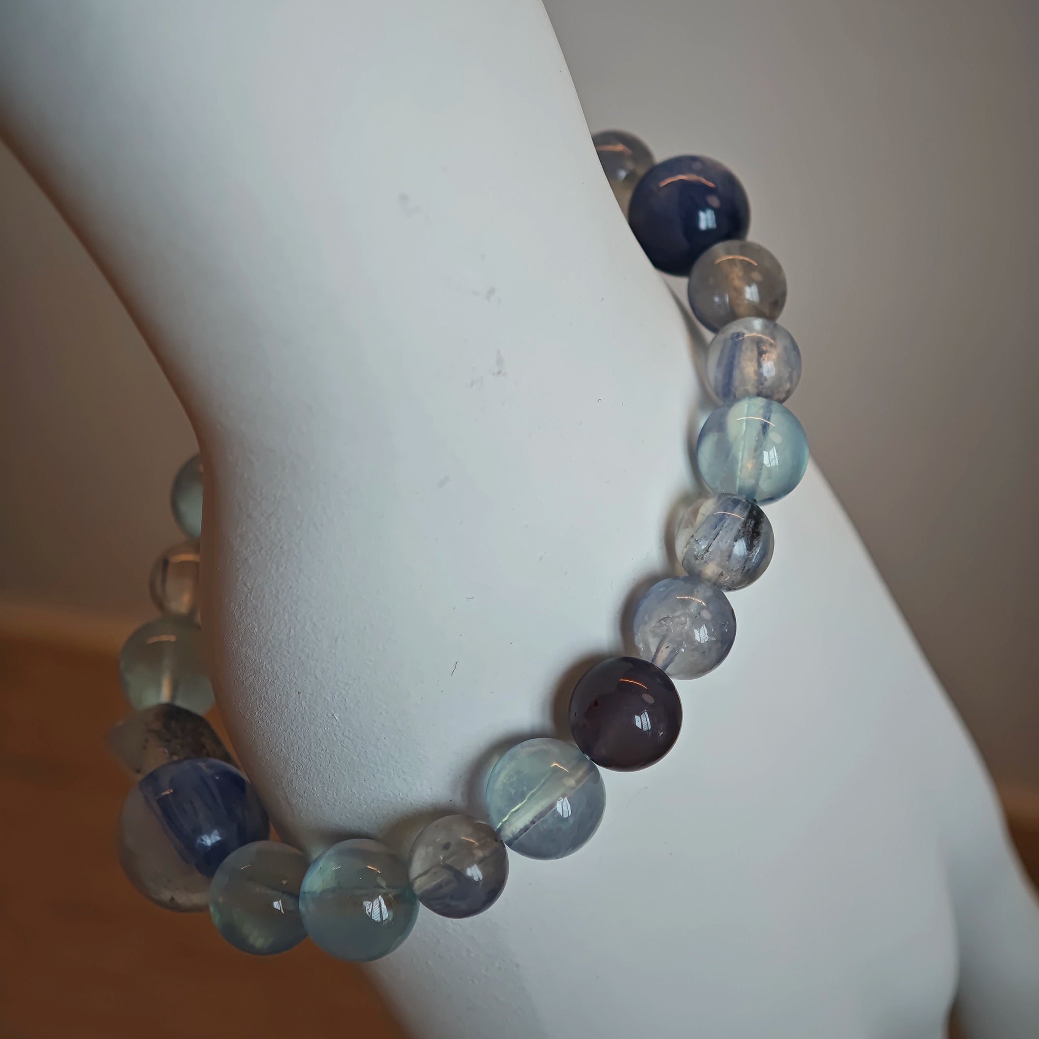 This is a gemstone bracelet consists of Kyanite, Blue Velvet Stone, Aquamarine, and Cordierite.