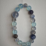This is a gemstone bracelet consists of Kyanite, Blue Velvet Stone, Aquamarine, and Cordierite.