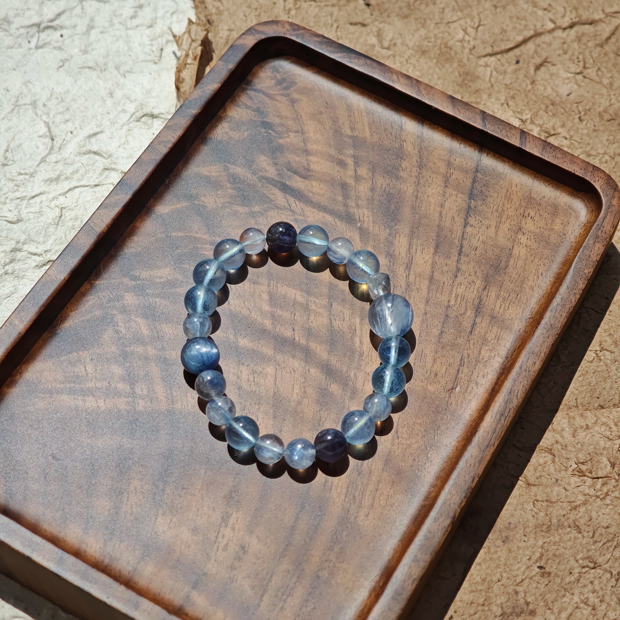 This is a gemstone bracelet consists of Kyanite, Blue Velvet Stone, Aquamarine, and Cordierite.