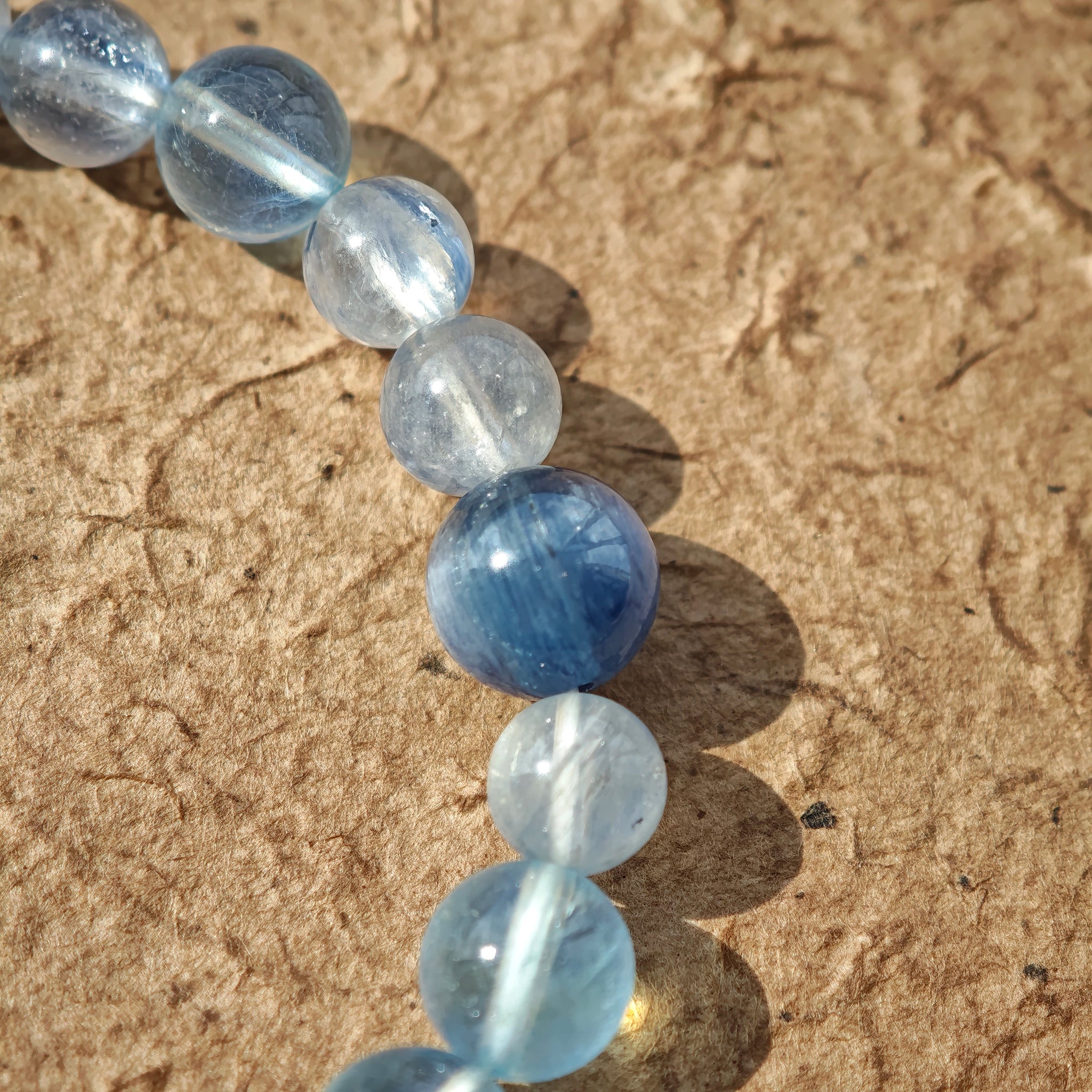 This is a gemstone bracelet consists of Kyanite, Blue Velvet Stone, Aquamarine, and Cordierite.
