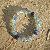 This is a gemstone bracelet consists of Kyanite, Blue Velvet Stone, Aquamarine, and Cordierite.