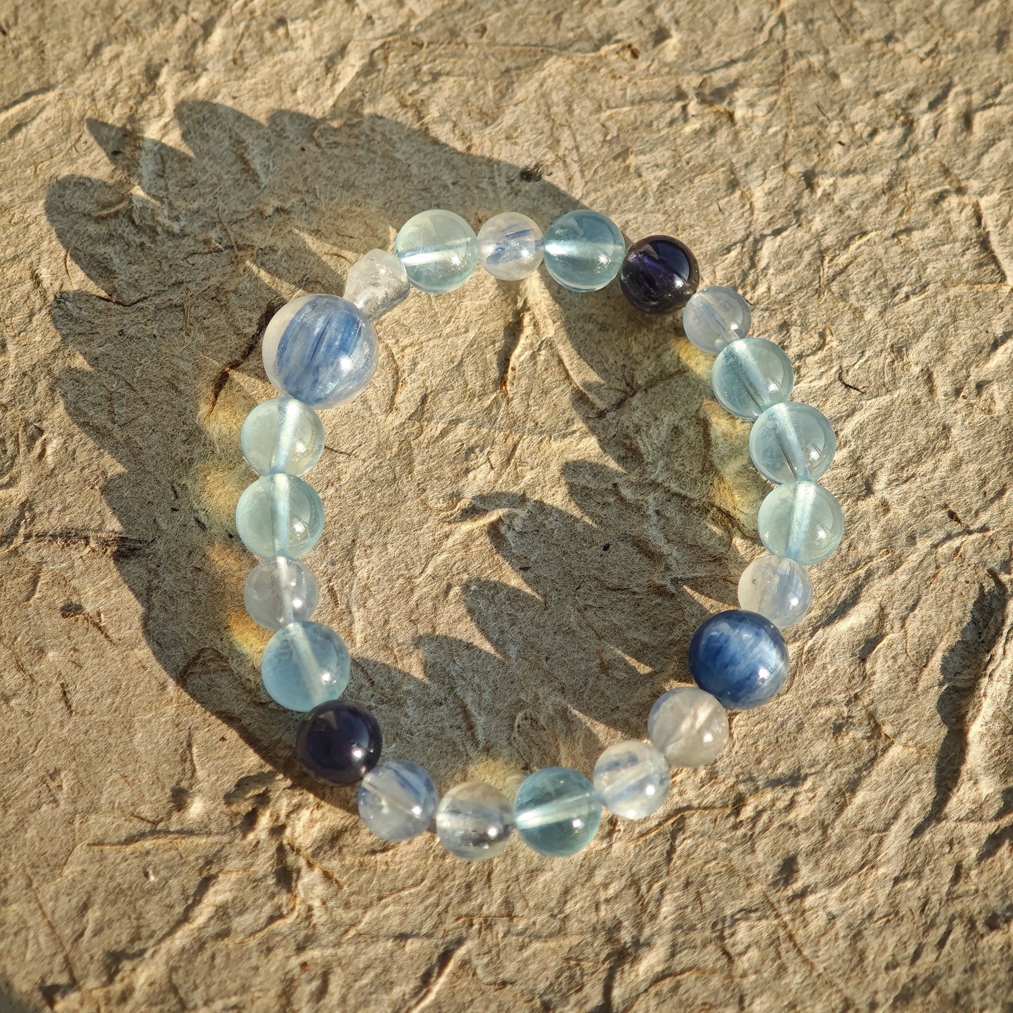 This is a gemstone bracelet consists of Kyanite, Blue Velvet Stone, Aquamarine, and Cordierite.