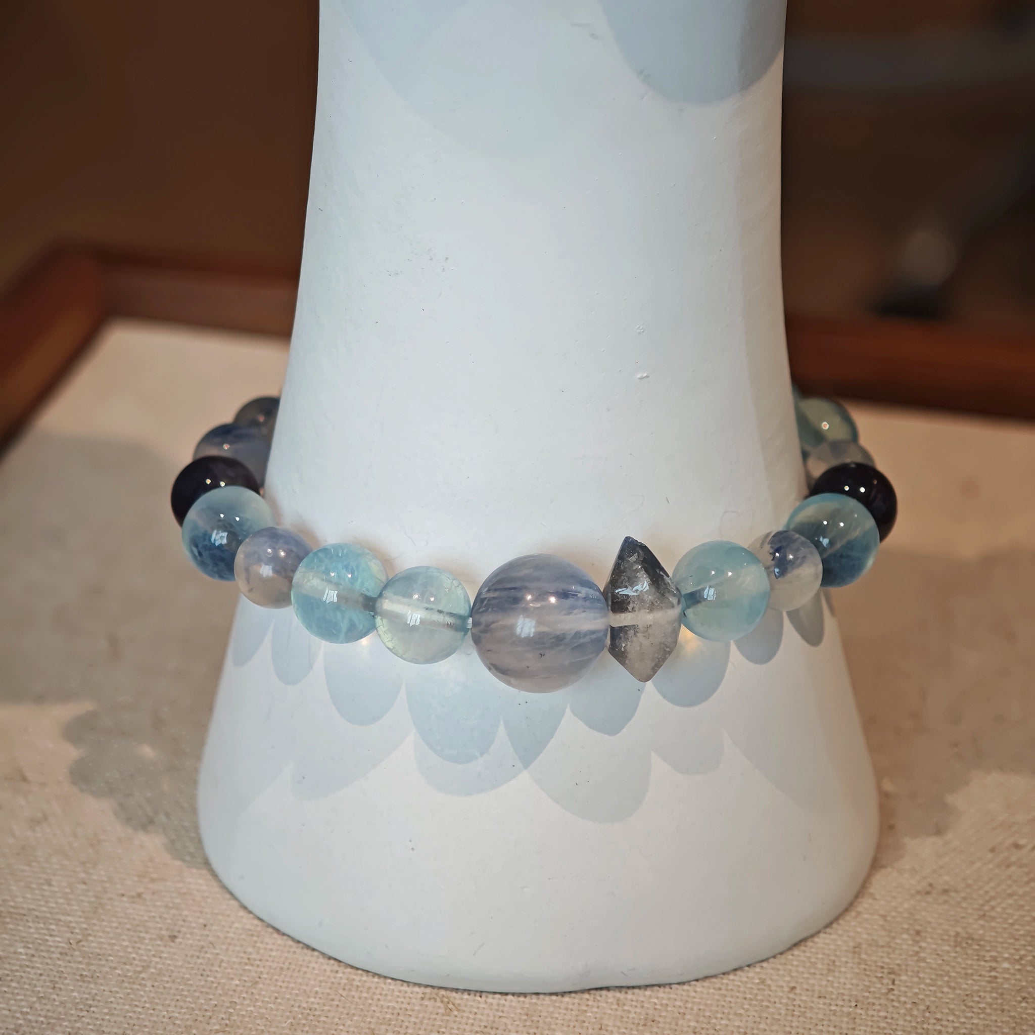 This is a gemstone bracelet consists of Kyanite, Blue Velvet Stone, Aquamarine, and Cordierite.