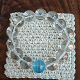 This is a crystal bracelet consists of 1 aquamarine and 13pcs of pure clear quartz.