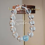 This is a crystal bracelet consists of 1 aquamarine and 13pcs of pure clear quartz.
