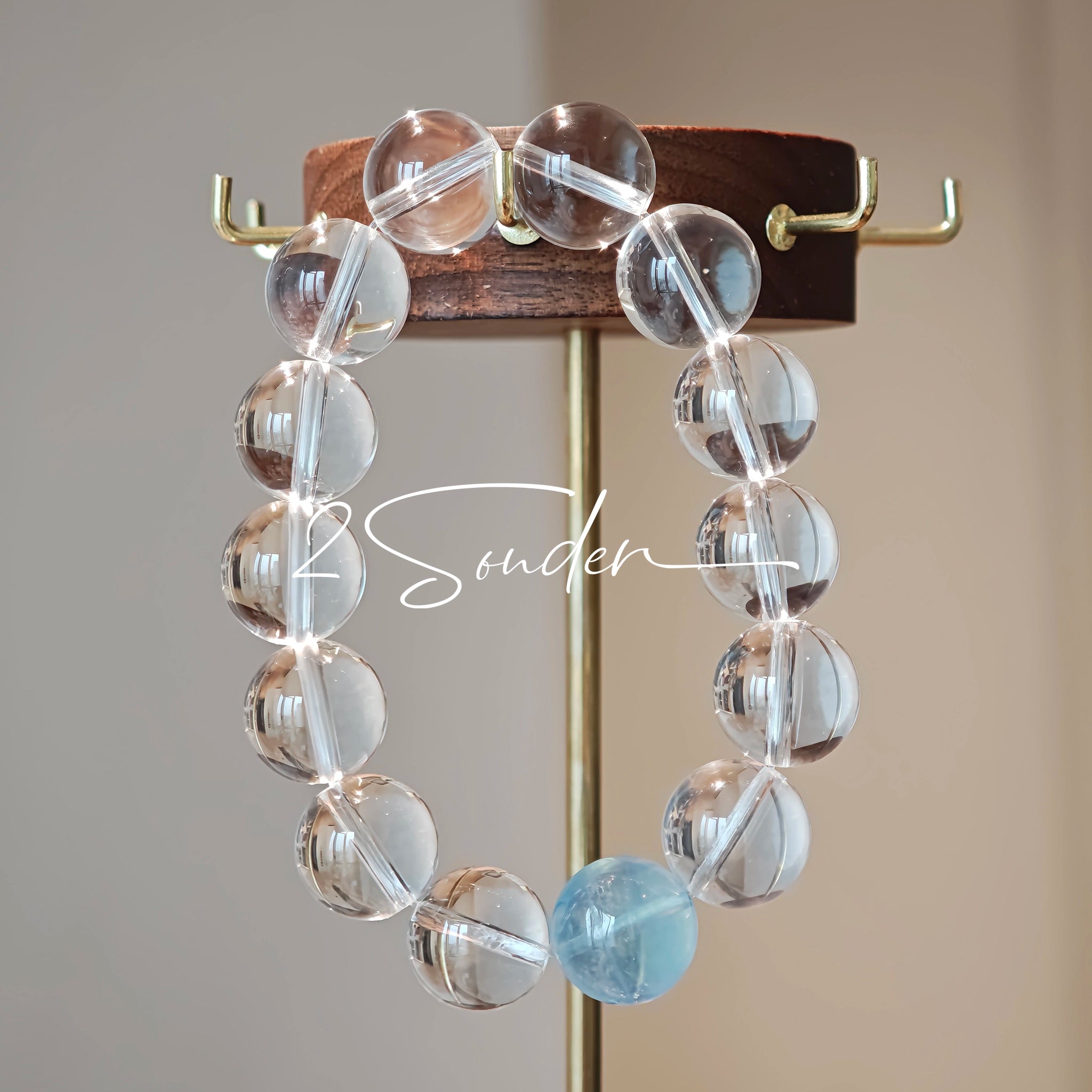 This is a crystal bracelet consists of 1 aquamarine and 13pcs of pure clear quartz.