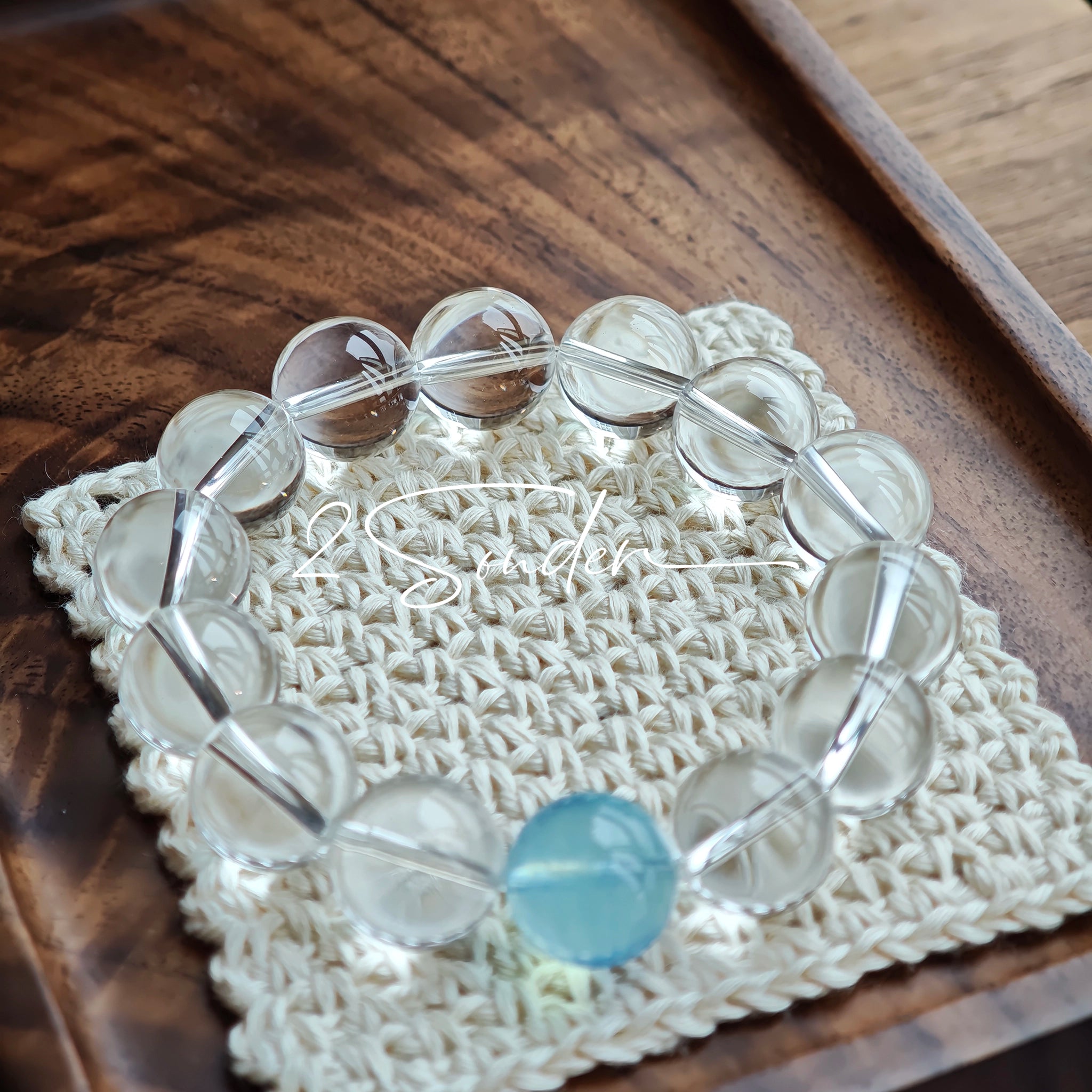 This is a crystal bracelet consists of 1 aquamarine and 13pcs of pure clear quartz.