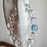 This is a crystal bracelet consists of 1 aquamarine and 13pcs of pure clear quartz.