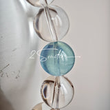 This is a crystal bracelet consists of 1 aquamarine and 13pcs of pure clear quartz.