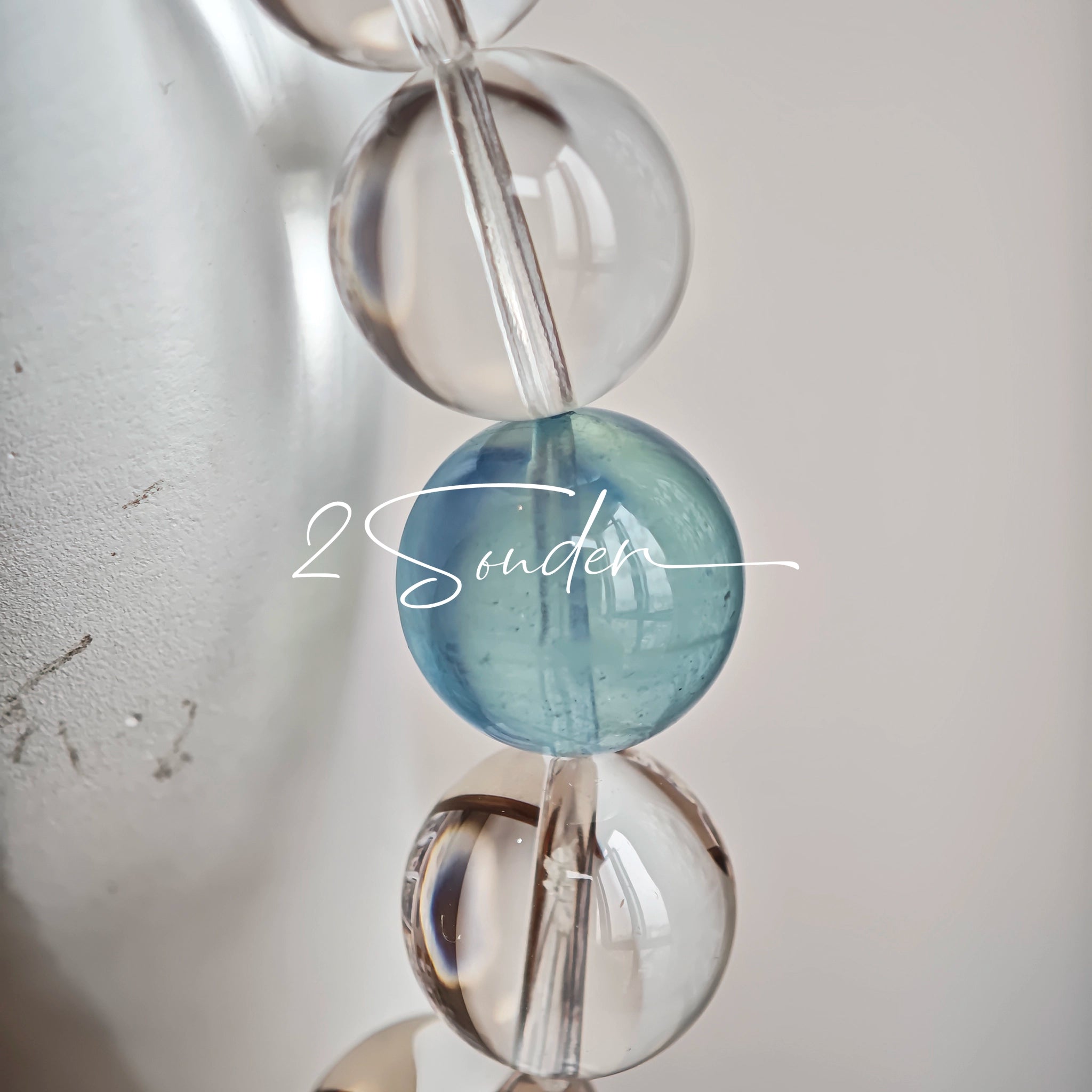 This is a crystal bracelet consists of 1 aquamarine and 13pcs of pure clear quartz.
