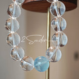 This is a crystal bracelet consists of 1 aquamarine and 13pcs of pure clear quartz.