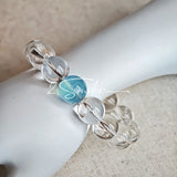 This is a crystal bracelet consists of 1 aquamarine and 13pcs of pure clear quartz.