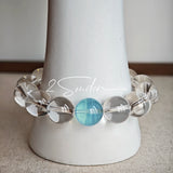 This is a crystal bracelet consists of 1 aquamarine and 13pcs of pure clear quartz.